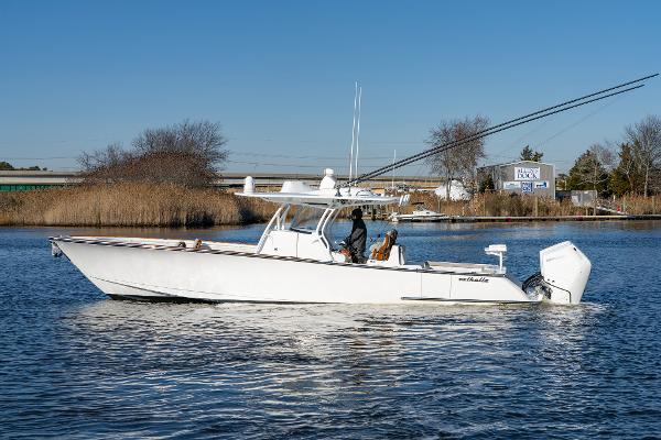 Valhalla Boatworks V-37 2023 Valhalla Boatworks V-37 cruising on a calm river under clear blue skies.