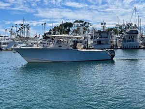 Grady-White Canyon 336 2017 Grady-White Canyon 336 boat docked in a marina under a blue sky.