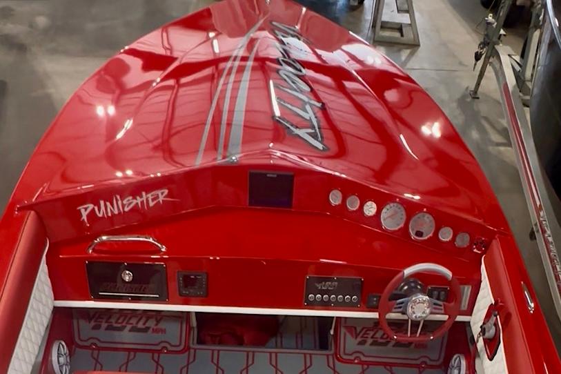 Velocity 22 Punisher Red 2026 Velocity 22 Punisher speedboat with sleek design and detailed dashboard.