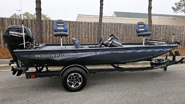 Ranger RT188C 2024 Ranger RT188C fishing boat with Mercury engine, parked on trailer.