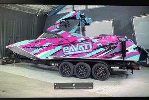 Pavati AL26 2021 Pavati AL26 boat with vibrant pink and teal design on a trailer.
