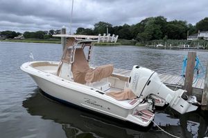 Pioneer 202 Islander 2020 Pioneer 202 Islander boat docked by a serene lake with overcast skies.