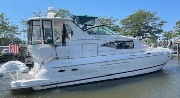 Cruisers Yachts 4450 Express Motor Yacht 2000 Cruisers Yachts 4450 Express Motor Yacht docked in a marina.