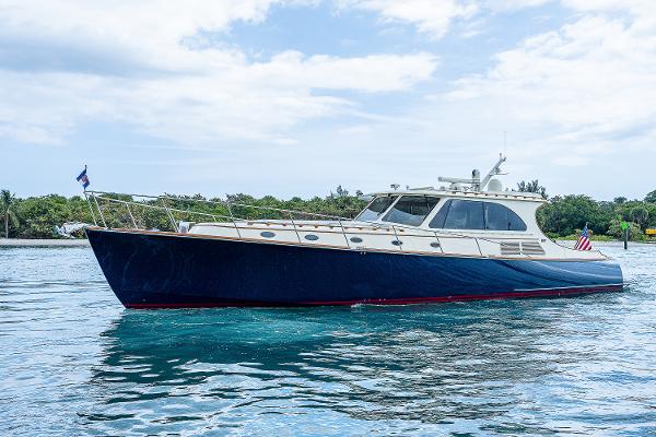 Hinckley Talaria 55 MKII MY 2018 Hinckley Talaria 55 MKII MY yacht cruising on calm waters under a partly cloudy sky.