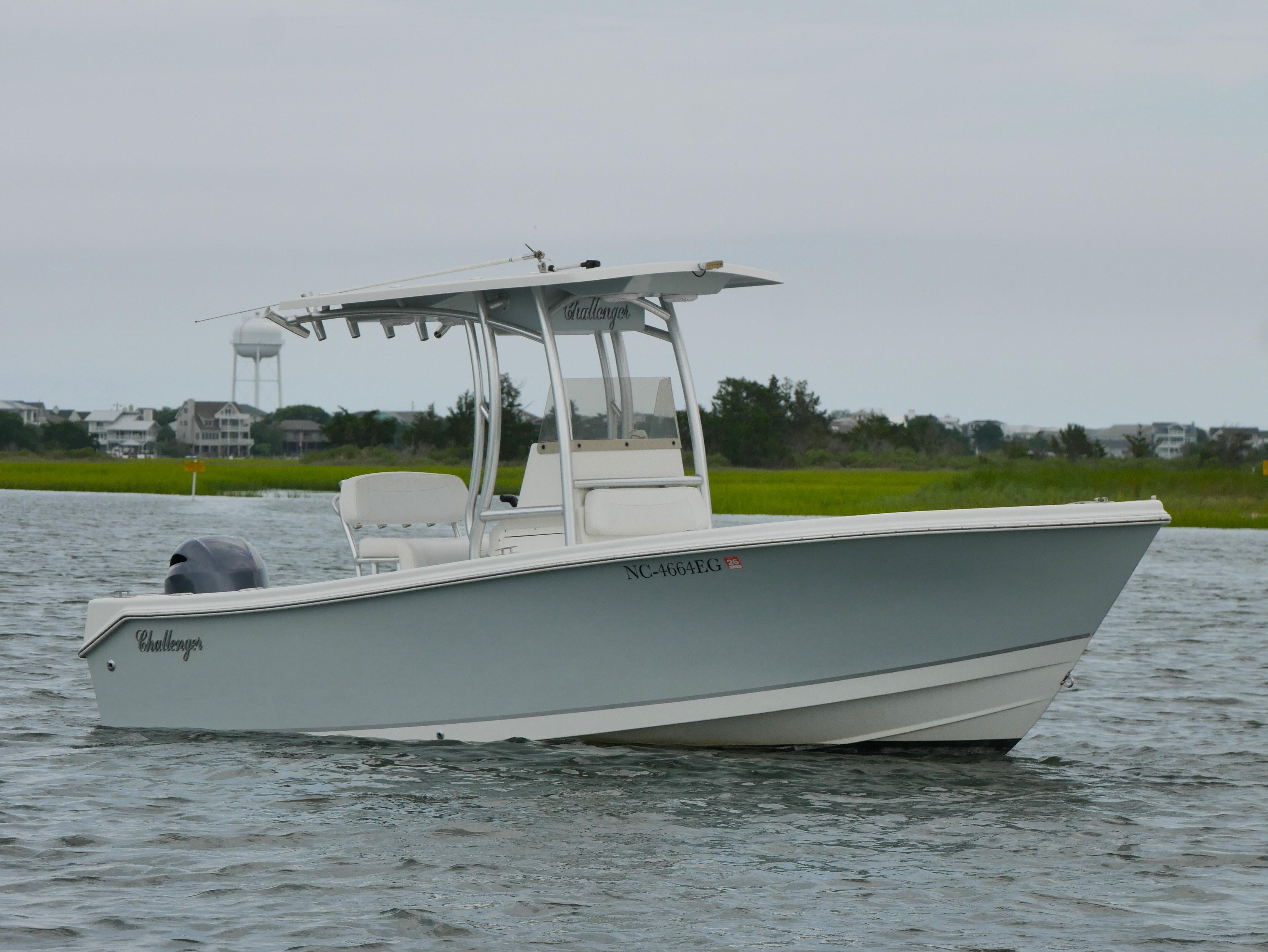 KenCraft Challenger 21 2018 KenCraft Challenger 21 boat on water, with coastal background.