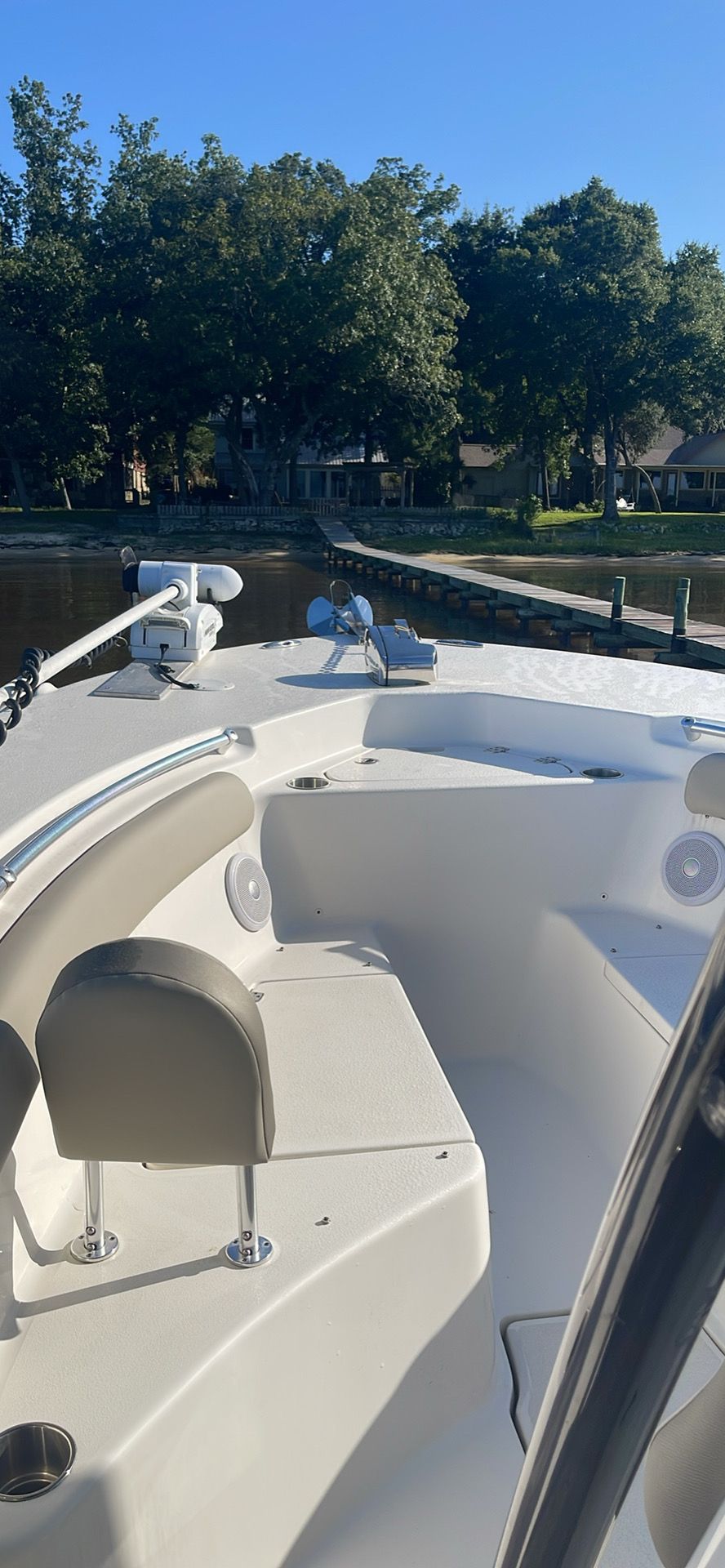 Key West 244 Center Console 2023 Key West 244 Center Console boat docked by a scenic lakeside.