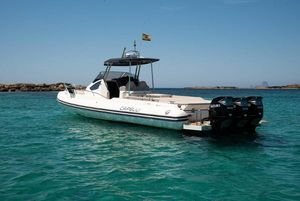 Capelli Tempest 44 2019 Capelli Tempest 44 boat on clear turquoise water, featuring triple outboard engines.
