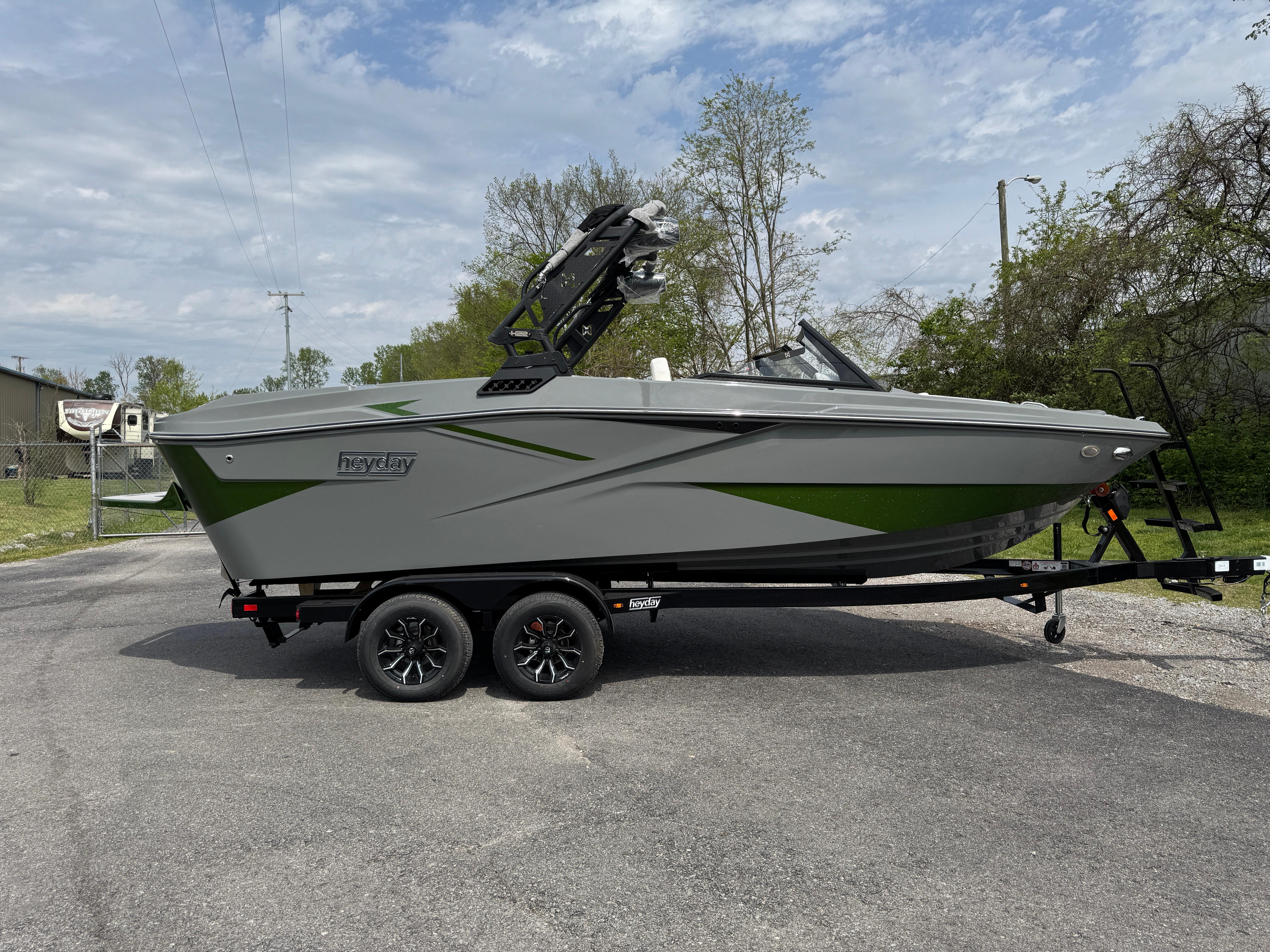 Heyday H22 2025 Heyday H22 boat on trailer, gray and green design, parked outdoors.