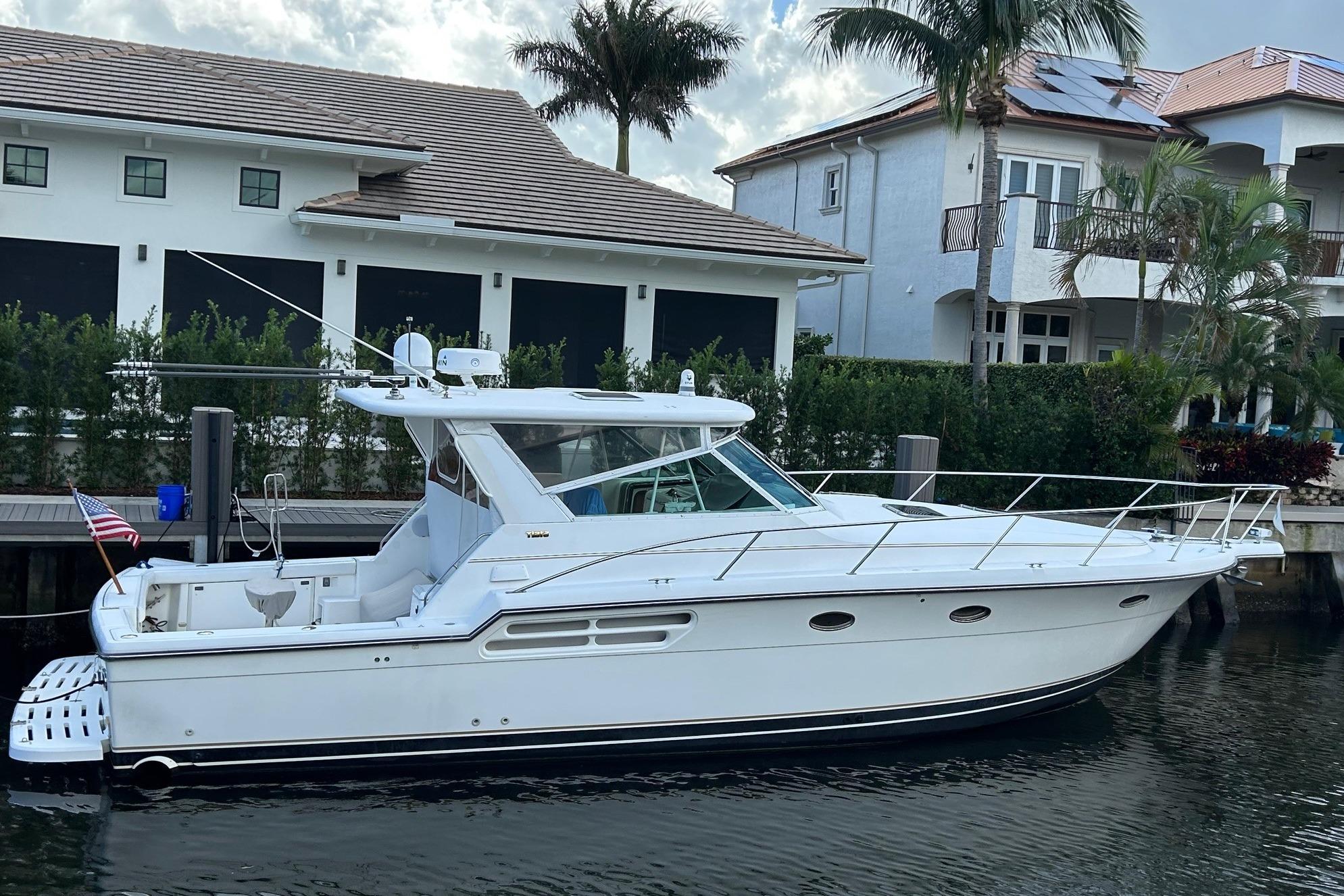 Tiara Yachts 4100 Open 2001 Tiara Yachts 4100 Open docked near waterfront homes, showcasing sleek design.