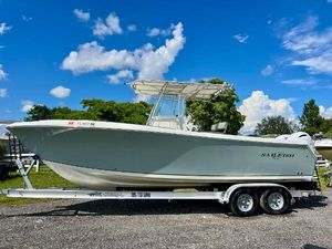 Sailfish 2660 CC 2006 Sailfish 2660 CC boat on trailer under blue sky.