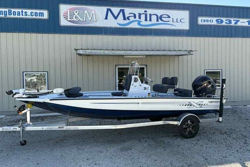 Xpress H20B Bay 2026 Xpress H20B Bay boat on trailer outside L&M Marine dealership.