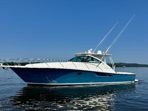 Tiara Yachts 4300 Open 2019 Tiara Yachts 4300 Open cruising on calm waters under a clear blue sky.