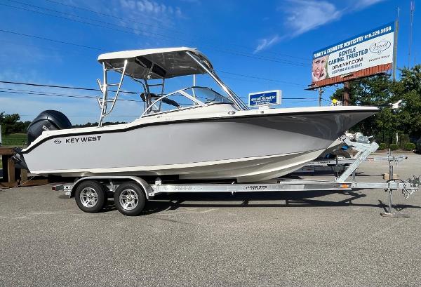 Key West 239 DFS 2024 Key West 239 DFS boat on a trailer under a clear blue sky.