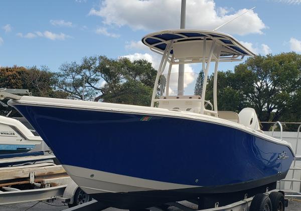 Sea Chaser 22 HFC 2021 Sea Chaser 22HFC boat with blue hull on trailer, parked outdoors.