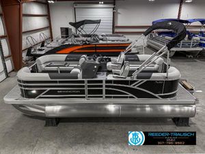 Bennington 20 SSR 2025 Bennington 20 SSR pontoon boat in showroom, featuring sleek design and modern seating.
