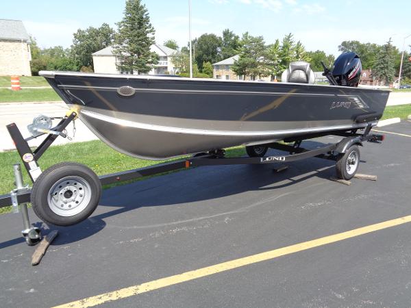 Lund 1600 Fury Tiller 2024 Lund 1600 Fury Tiller boat on trailer, parked outdoors.