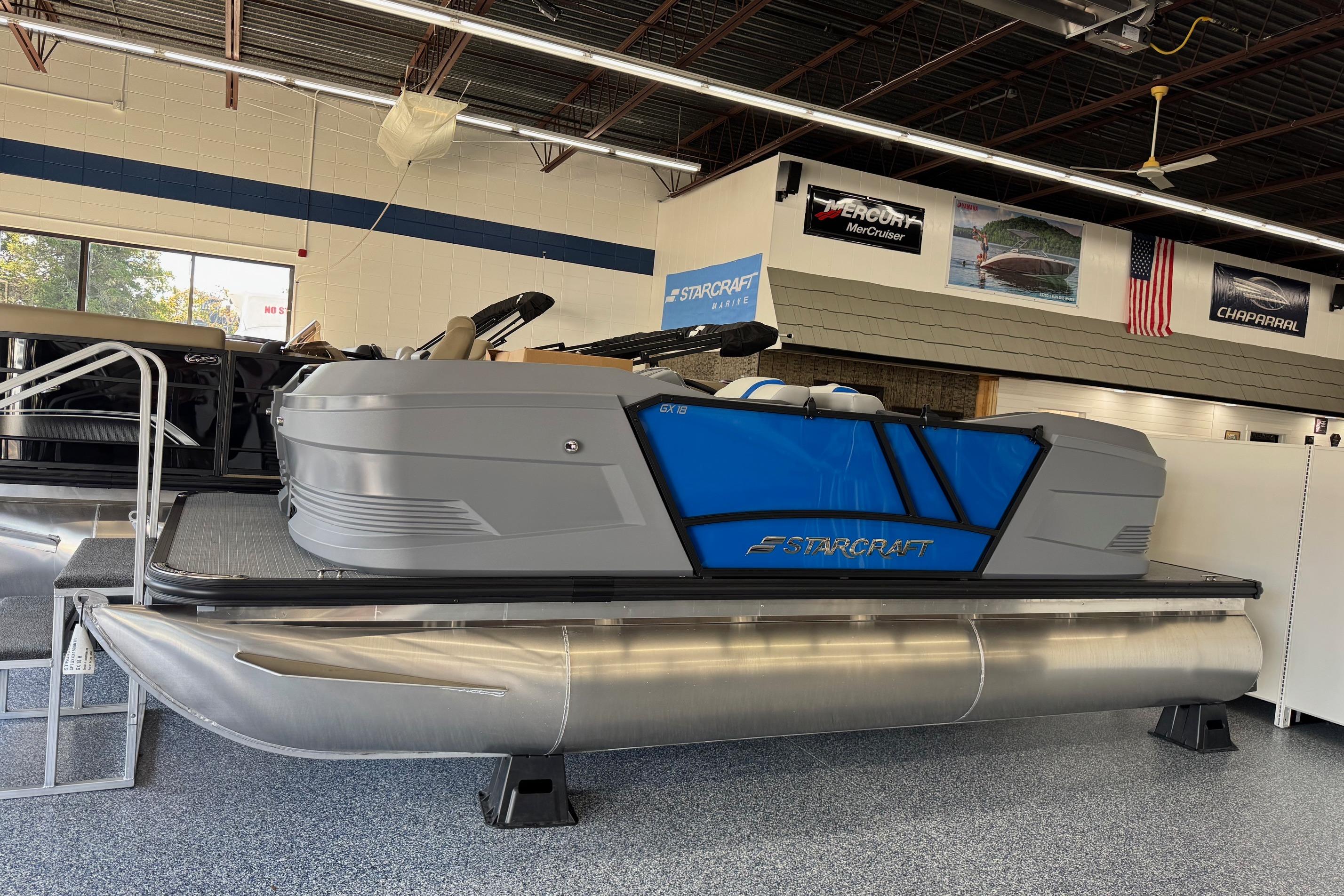 Starcraft GX 18 R 2026 Starcraft GX 18 R pontoon boat displayed in showroom with modern design.