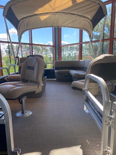 Sun Tracker Bass Buggy 16 XL Select 2025 Sun Tracker Bass Buggy 16 XL Select interior with seating and canopy.