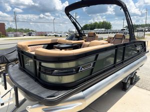 Godfrey AquaPatio 23' Flip Lounge Tritoon - 235 SFLC 2026 Godfrey AquaPatio 23' Flip Lounge Tritoon, sleek design, luxurious seating, outdoor setting.