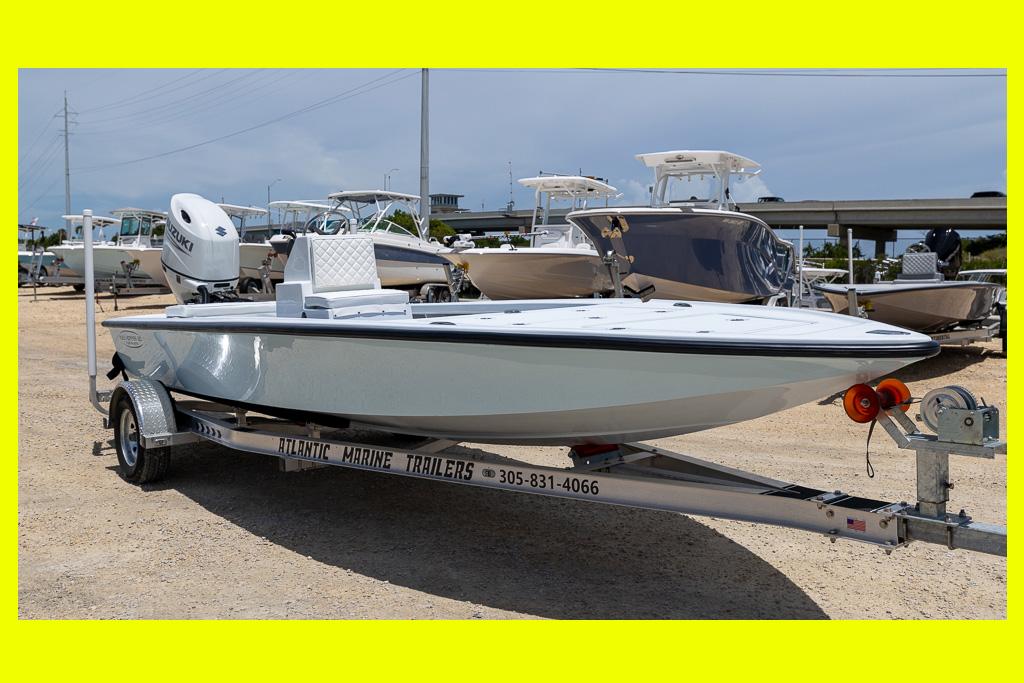 Custom Key Hopper 20 2024 Custom Key Hopper 20 boat on trailer, parked outdoors, with Suzuki engine.