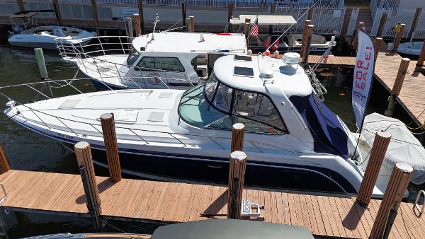 Formula 40 PC 2004 Formula 40 PC yacht docked at marina, featuring sleek design and spacious deck.