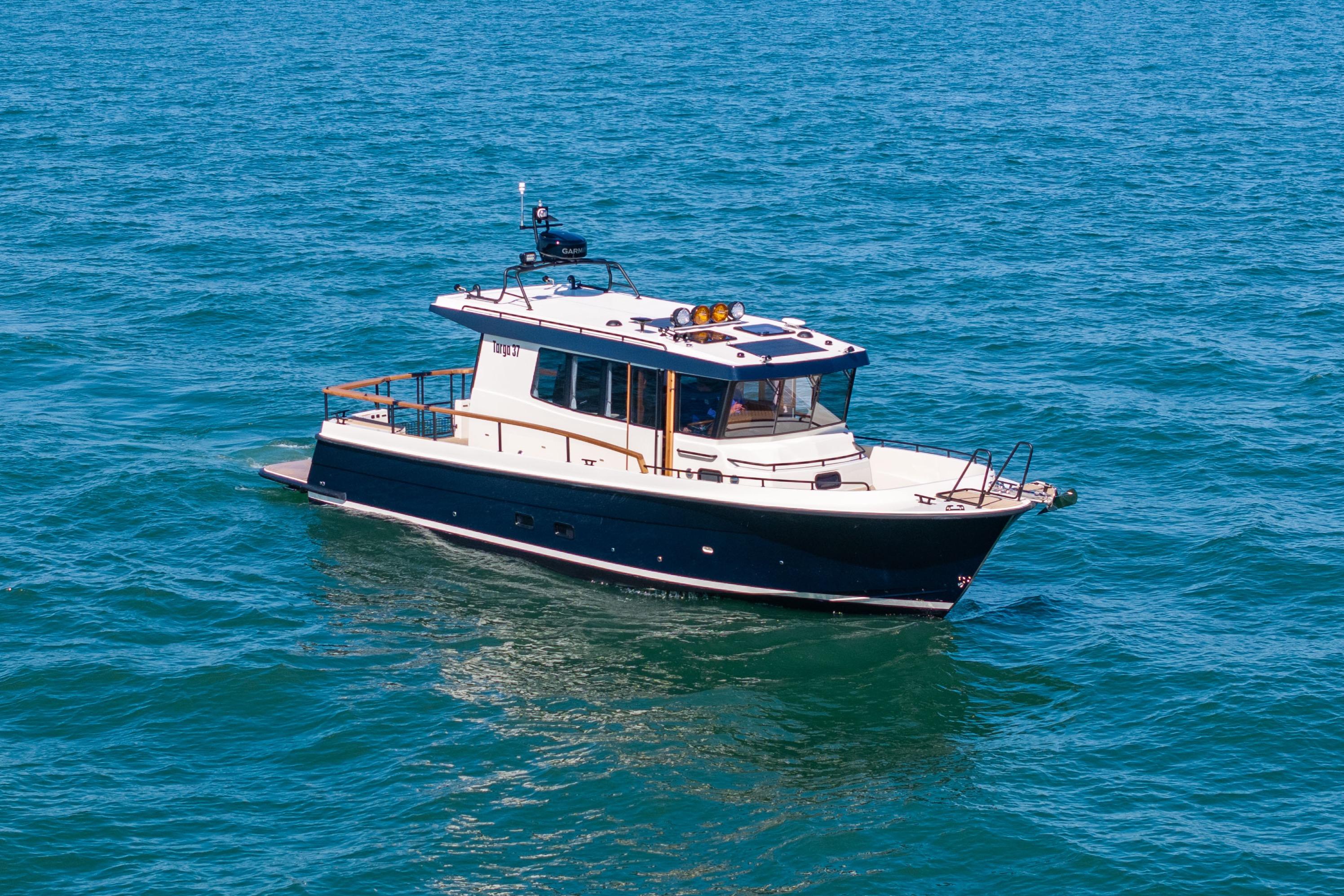 Targa 37 2025 Targa 37 boat cruising on open blue water.