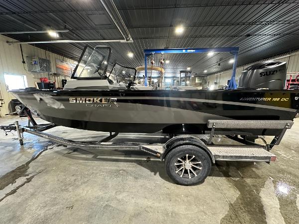 Smoker Craft Adventurer 188 DC 2025 Smoker Craft Adventurer 188 DC boat on trailer in indoor garage.