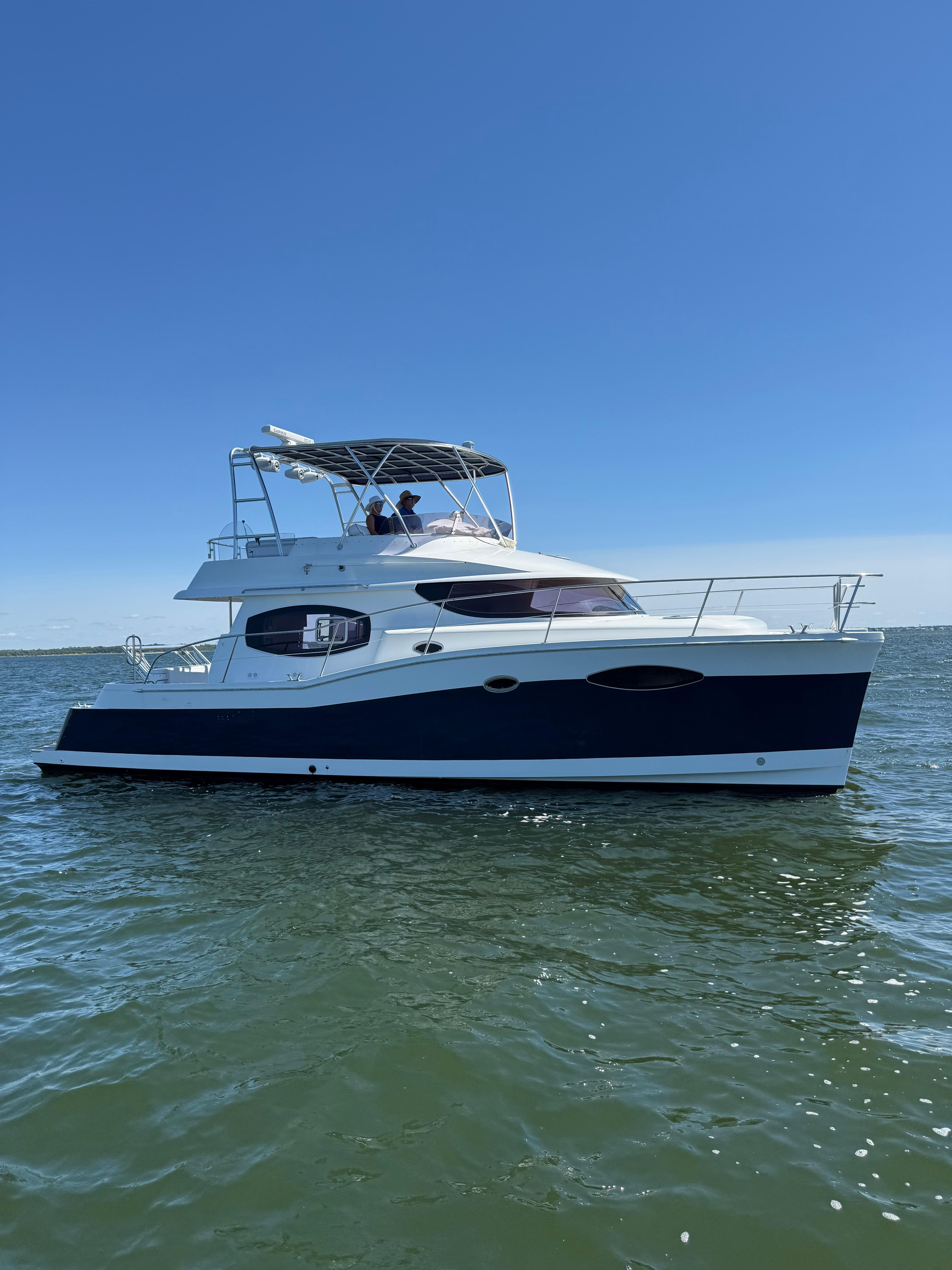 Fountaine Pajot 40 2012 Fountaine Pajot 40 catamaran on calm water under clear blue sky.