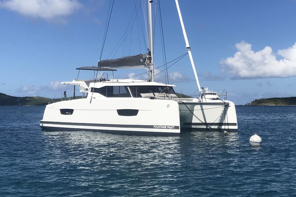 Fountaine Pajot Isla 40 2021 Fountaine Pajot Isla 40 catamaran sailing on calm blue waters.