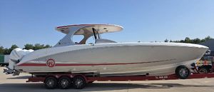 Mystic Powerboats M4200 2019 Mystic Powerboats M4200 on trailer, sleek white design with red accents.