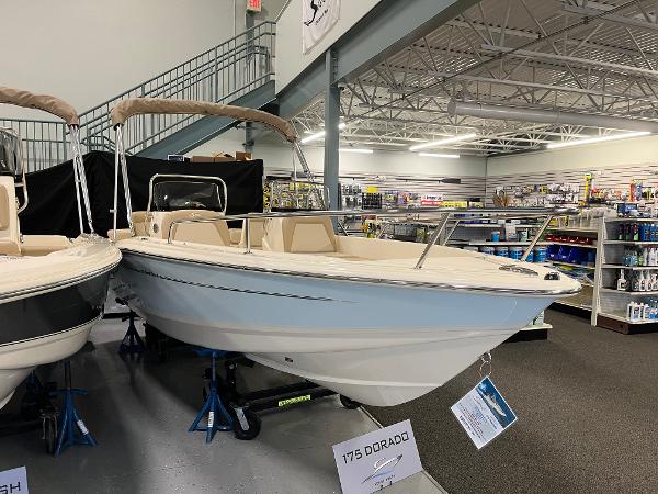 Scout 175 Sport Dorado 2025 Scout 175 Sport Dorado boat displayed in a showroom.