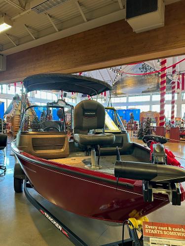 Tracker Pro Guide V-16 WT 2025 Tracker Pro Guide V-16 WT boat displayed indoors with festive decorations.