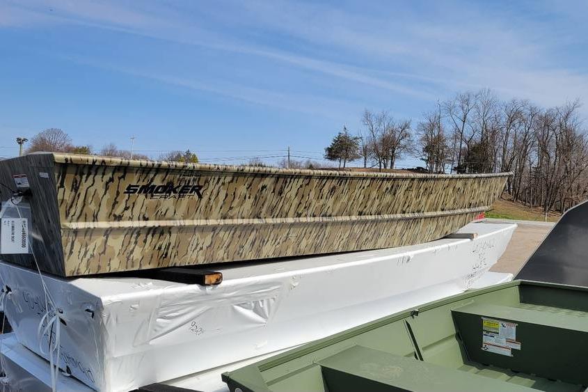 Smoker Craft 1648 jon boat, 16', 48" bottom width, 20" transom 2025 Smoker Craft 1648 jon boat with camouflage design, 16-foot length, displayed outdoors.
