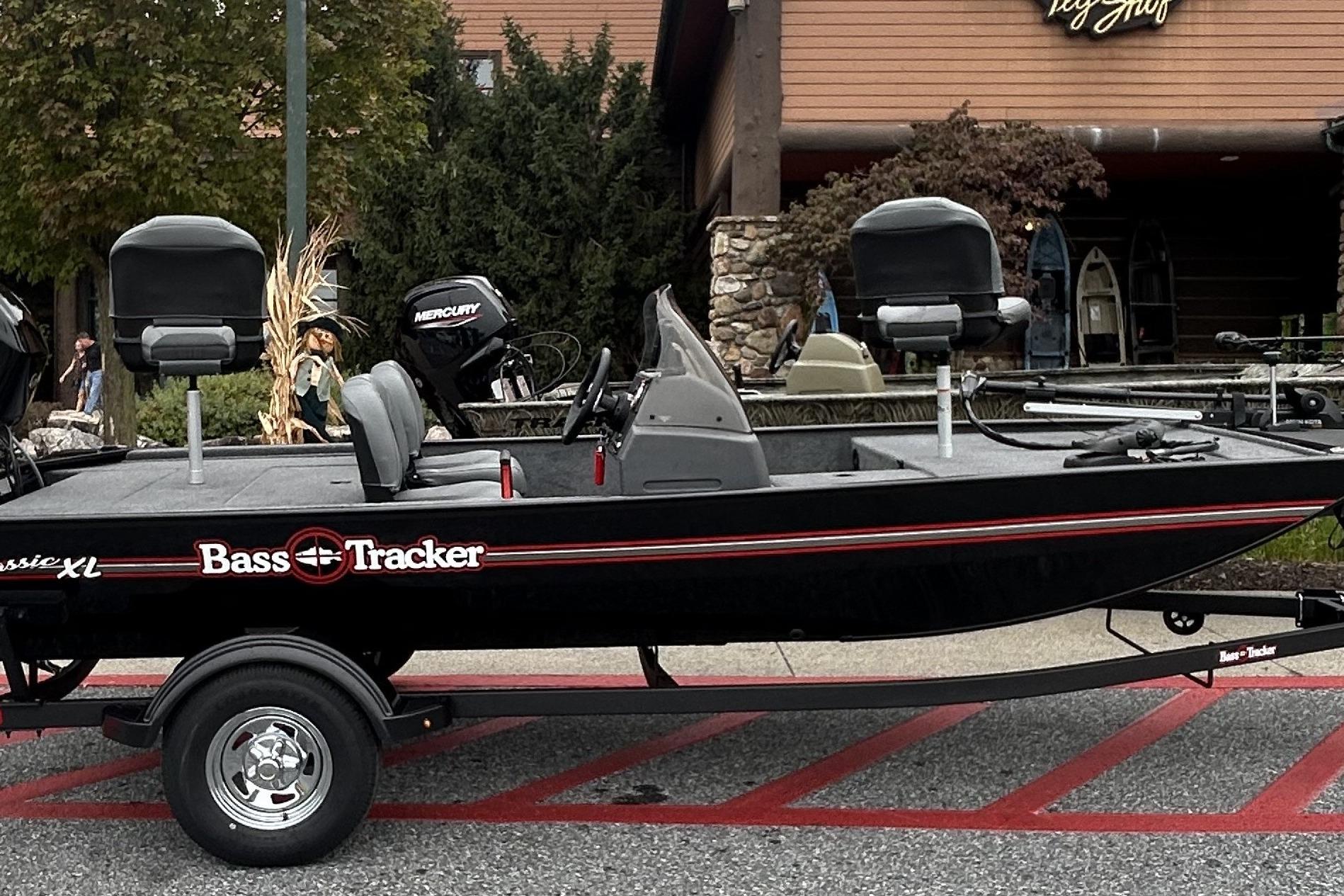 Tracker Bass Tracker Classic XL 2026 Tracker Bass Tracker Classic XL boat on trailer, parked outside a store.