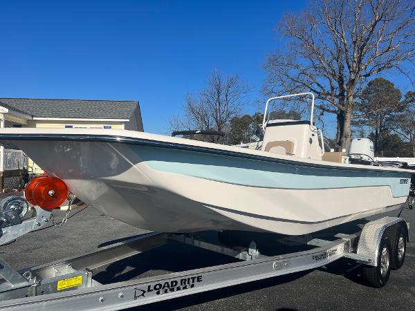 Sundance B22CCR 2025 Sundance B22CCR boat on Load Rite trailer, parked outdoors.