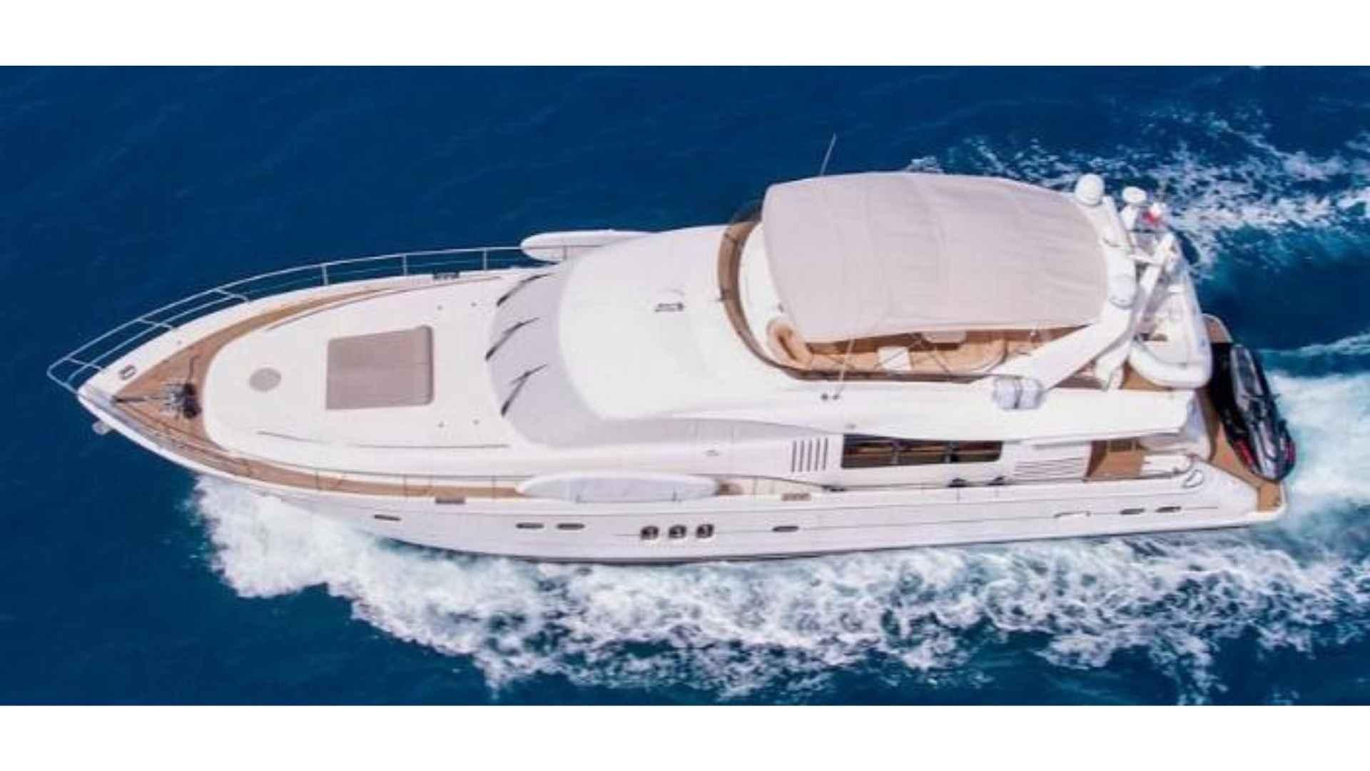 Princess 82 Luxurious 2004 Princess 82 yacht cruising on open blue sea.
