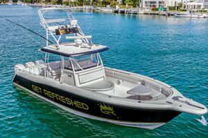 Stamas 390 Tarpon 2016 Stamas 390 Tarpon boat on clear blue water, featuring "Get Refreshed" branding.