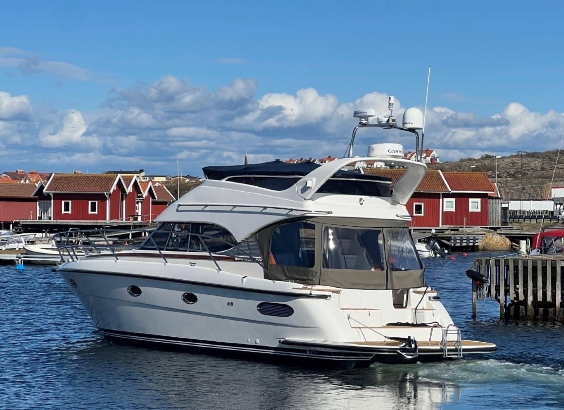 Nord West 370 Flybridge Nord West 370 Flybridge 2009 yacht in a scenic harbor setting.