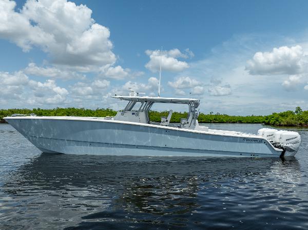 Freeman 42 LR 2019 Freeman 42 LR boat on calm water with blue sky and clouds.