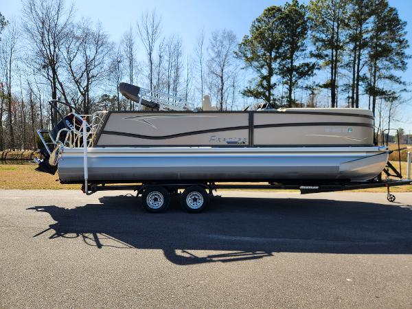 Premier 230 Sun Station 2020 Premier 230 Sun Station pontoon boat on trailer, parked outdoors.