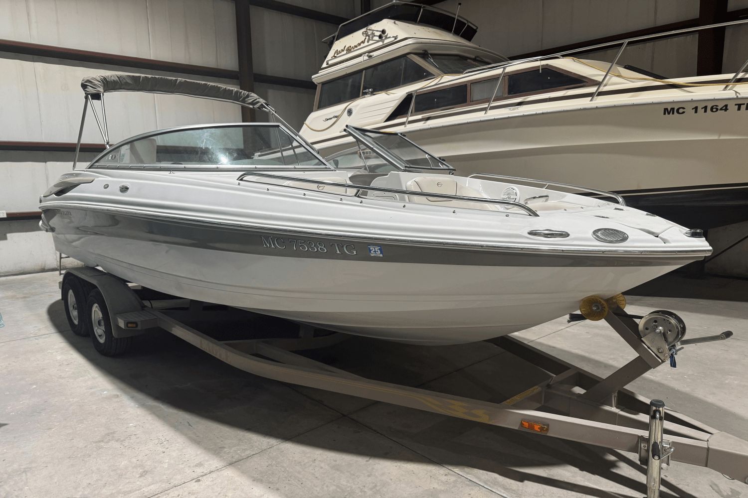 Crownline 220 LS 2006 Crownline 220 LS boat on trailer in indoor storage facility.