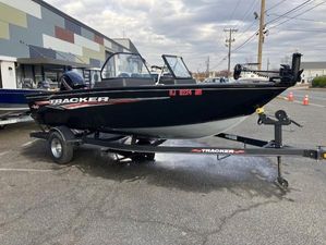 Tracker Pro Guide V-175 WT 2022 Tracker Pro Guide V-175 WT boat on trailer in parking lot.