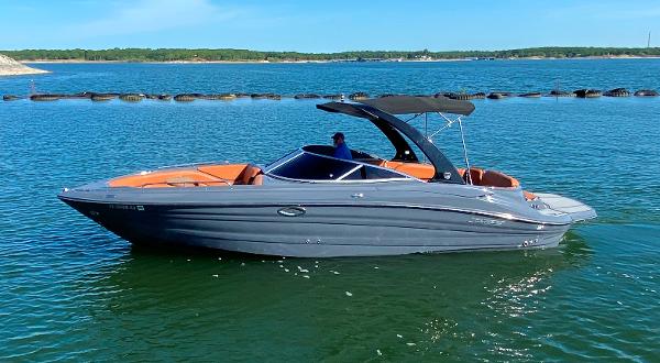 Cruisers Sport Series 298 SS South Beach Edition 2017 Cruisers Sport Series 298 SS South Beach Edition boat on calm water.