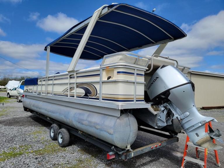 Crest 30 Savannah 1999 Crest 30 Savannah pontoon boat with Honda outboard motor on trailer.
