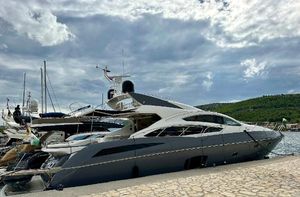 Sunseeker Predator 74 Sunseeker Predator 74 yacht docked at marina under cloudy sky, 2010 model.