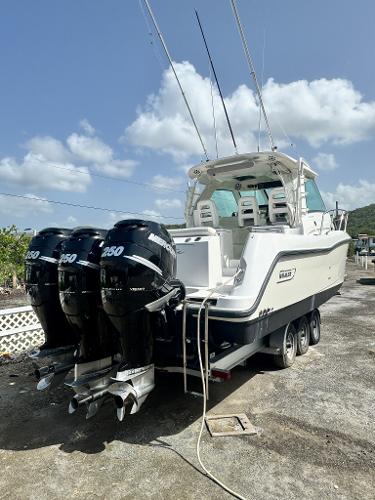 Boston Whaler 345 Conquest 2012 Boston Whaler 345 Conquest with triple Mercury 250 engines on trailer.