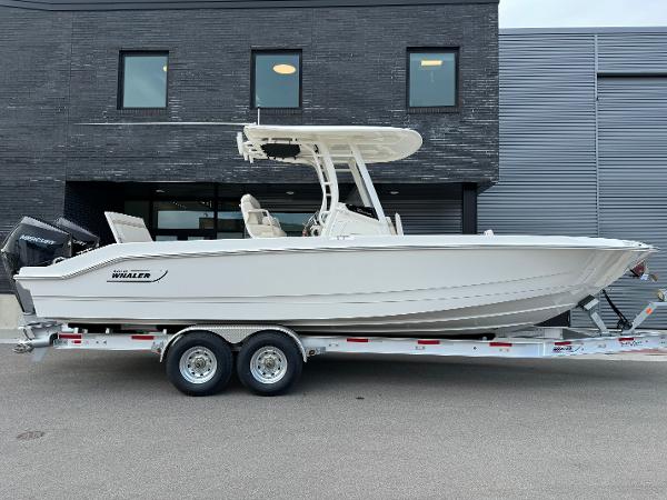 Boston Whaler 280 Dauntless 2024 Boston Whaler 280 Dauntless boat on a trailer, side view.