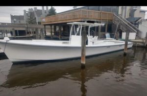 Robbins 40 Center Console 1999 Robbins 40 Center Console boat docked at a marina.