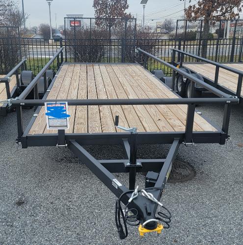 Tracker KTO-6500-82-18 (7x18) 2024 Tracker KTO-6500-82-18 utility trailer with wooden deck and metal frame.