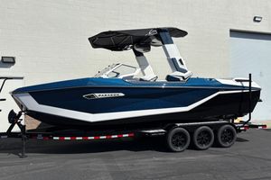 Nautique Super Air Nautique G25 Paragon 2026 Nautique Super Air Nautique G25 Paragon boat on trailer, side view.